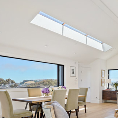 Living room. Expansive views to Bernal Heights and Bay. Open kitchen adjacent with garden views.